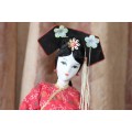 A COLLECTION OF FOUR STUNNING ORIENTAL DOLLS IN THEIR TRADITIONAL CLOTHING bid/doll