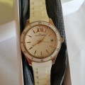 AN INCREDIBLE WHITE JACQUES LEMANS LADIES "ROME" SPORTS WRIST WATCH WITH GOLD DETAILING