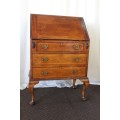 A SUPERB ANTIQUE SOLID TEAK "PAD-FOOT" FLIP-TOP WRITING DESK WITH THREE DRAWERS & INLAY DETAILING