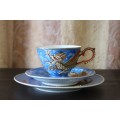 A beautiful Japanese "Dragonware" Moriage porcelain tea trio incl. the teacup, saucer & cake plate