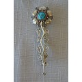 A SPECTACULAR (SOUTH AMERICAN) 900 SILVER LADIES BROOCH WITH A CENTRE TURQUOISE STONE