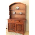 A stunning teak buffet server w/ two display shelves and ample storage space in remarkable condition