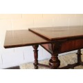 A superb antique 6 to 8 seater walnut extendable "monastery" table with a "hidden" extension panels