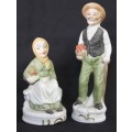 Two wonderful ceramic figurines of an a farmer and his wife with hand painted detailing bid/figurine