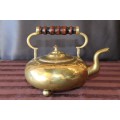 An exquisite antique Victorian (c.1850) brass footed toddy kettle with wooden handle