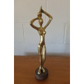 An incredible (tall) solid brass abstract figurine on a wooden stand in stunning condition