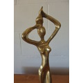 An incredible (tall) solid brass abstract figurine on a wooden stand in stunning condition