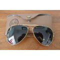 A wonderful pair of vintage authentic Ray Ban aviators in original brown pouch in good condition