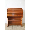 An incredible vintage solid oak roll top writing bureau with pull out writing top - very compact!