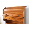 An incredible vintage solid oak roll top writing bureau with pull out writing top - very compact!