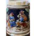 A wonderful vintage German made stoneware beer tankard w/ traditional hand glazed detailing