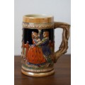 An awesome vintage German made stoneware beer tankard w/ traditional hand glazed detailing