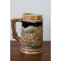 An awesome vintage German made stoneware beer tankard w/ traditional hand glazed detailing