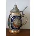 An incredible vintage West-German made stoneware (lidded) Stein w/ traditional hand glazed detailing