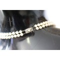 A spectacular double-strand pearl necklace with a sterling silver engraved clasp & pearl earrings