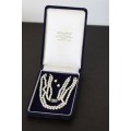 A spectacular double-strand pearl necklace with a sterling silver engraved clasp & pearl earrings