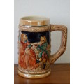 An amazing vintage German made stoneware beer tankard w/ traditional hand glazed detailing