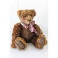 A gorgeous hand made by Nicky Roberts stuffed teddy bear with genuine fur in spectacular condition
