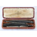 A superb set of antique "The Alexander Clark Co Ltd" cut throat razors in their original box