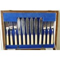 A wonderful vintage 52 piece cutlery set in a stunning vintage 3-division wooden canteen