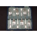 A fabulous boxed set of English made "Angora" EPNS silver plated cake forks w/ matching sugar spoon