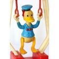 A wonderful vintage Walt Disney "Donald Duck Trickey Trapeze" toy in fantastic condition
