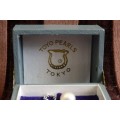 A stunning vintage genuine "Akoya" cultured white pearl gentleman's tie tack in its original box