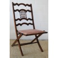 A fabulous teak Victorian antique garden/ patio folding chair w/ upholstered seat and spindle back