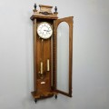 A magnificent vintage German made solid oak Hermle wall clock with porcelain face & the original key