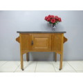 A spectacular vintage Oak wash stand with a solid black marble top & spacious cupboard on castors