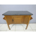 A spectacular vintage Oak wash stand with a solid black marble top & spacious cupboard on castors