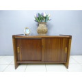 A stunning Teak cabinet with sliding doors and loads of space!! Lovely in a home or office!!!