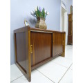 A stunning Teak cabinet with sliding doors and loads of space!! Lovely in a home or office!!!