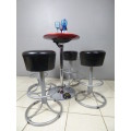 A fabulous modern "Red Apple" aluminium cocktail table with 4 bar stools. Awesome in bar areas/patio