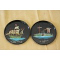 An incredible set of six black metal coasters with "Sailing Ships" from 20BC to 1850. RS17