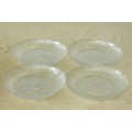 A gorgeous set of four "pressed" glass serving/ snack plates with beautiful design detailing RS17
