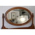 A magnificent antique solid oak dressing table w/ 6 drawers & a large beveled mirror on castors