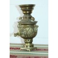 A beautiful antique solid brass ornamental "samovar" with hand chased detailing and a brass tap
