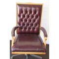 An incredible executive "claret red" leather button back swivel office chair with upholstery nails