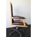 An incredible executive "claret red" leather button back swivel office chair with upholstery nails