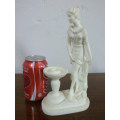 A lovely oxylite candle holder figurine of a lady in remarkable condition. Beautiful on display!!