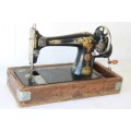 A spectacular antique (c.1919) Singer treadle manual sewing machine with stunning detailing