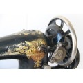 A spectacular antique (c.1919) Singer treadle manual sewing machine with stunning detailing