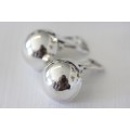 A magnificent pair of sterling silver stamped round clip-on earrings in remarkable condition