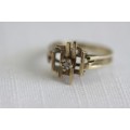 An awesome vintage solid 9ct yellow gold ladies ring with a single "prong" set diamond