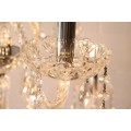 A spectacular three-tier crystal chandelier with curved glass arms and 21x light fittings = WOW!!