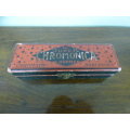 A wonderful vintage (1957) German made M Hohner Super Chromonica harmonica in its original box.