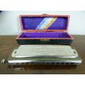 A wonderful vintage (1957) German made M Hohner Super Chromonica harmonica in its original box.