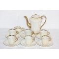 A beautiful mid-century "Wade" Royal Victoria Pottery white pearlescent lustre demitasse coffee set