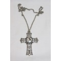 An exquisite LARGE ladies "Cross" pendant with a huge centre stone and a 60cm long chain